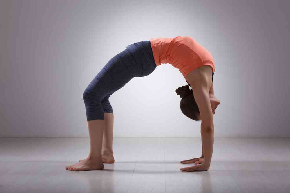girl doing yoga bridge pose